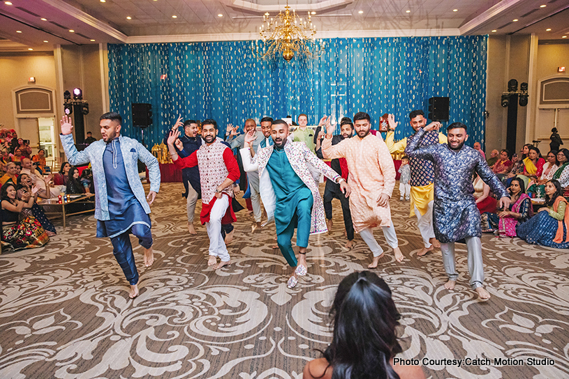 Indian grrom dancing with his friends