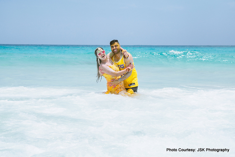 Indian wedding couple enjoying at beach