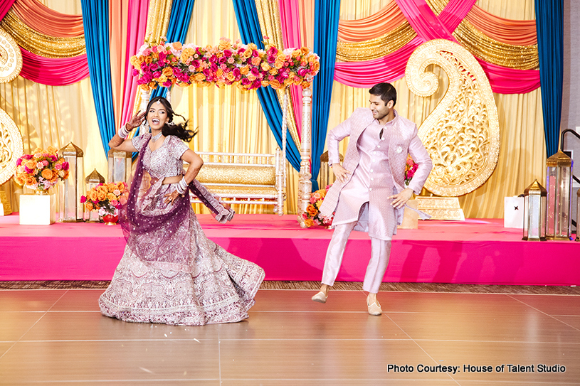 Indian wedding couple dancing together